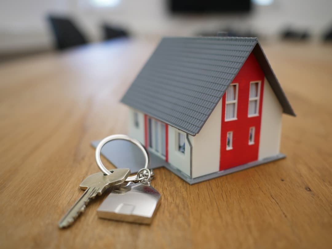 Rental property keys and house representing common landlord mistakes to avoid