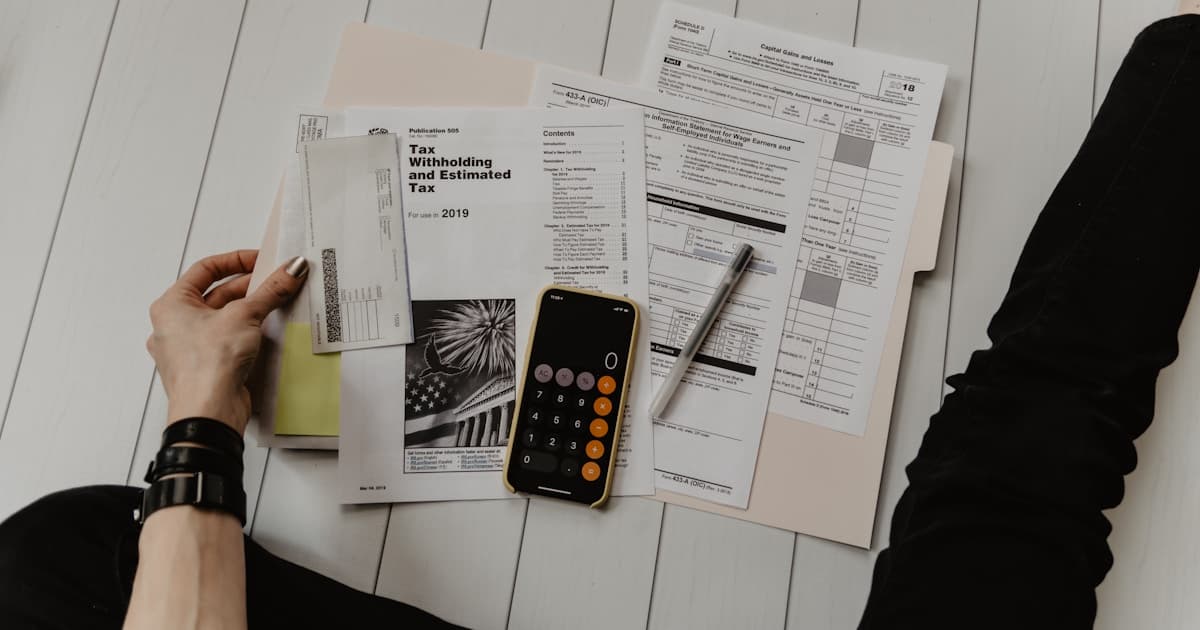 Financial documents and calculator representing security deposit accounting and compliance